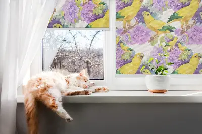 Fabric roller blind for window with yellow parrots print