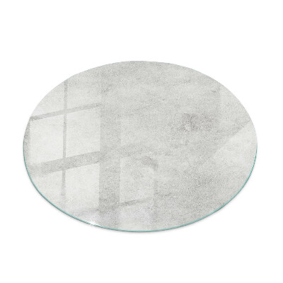 Round glass top for coffee table Scratches on the concrete surface