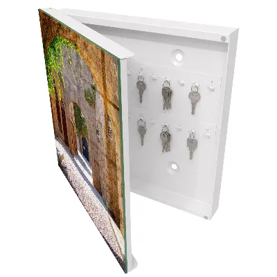 Wall mounted key box with a cobblestone street design