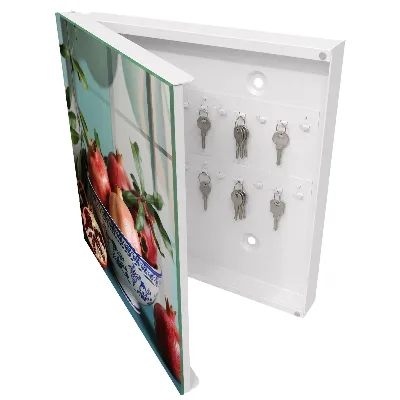Wall-mounted key box in navy blue with a fruit pattern