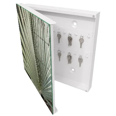 Key cabinet with palm leaf design