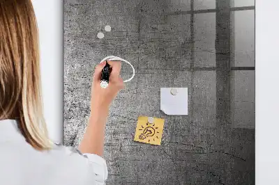 Magnetic dry erase board with a scratched metal finish