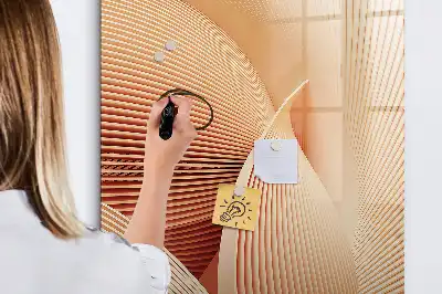 Magnetic writing board with an abstract wave pattern
