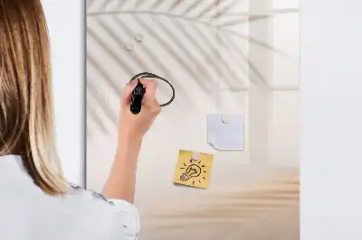 Magnetic writing board with a palm leaf shadow design