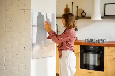 Magnetic writing board with a palm leaf shadow design