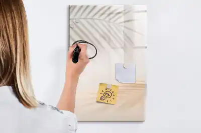 Magnetic writing board with a palm leaf shadow design