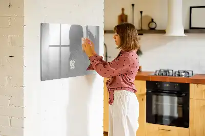 Magnetic glass dry erase board with a metal wall mount