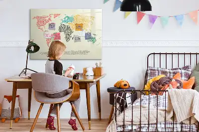 Magnetic glass dry erase board featuring a world map made from letters