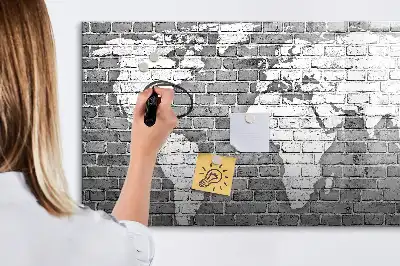 Magnetic glass dry erase board featuring a world map on a brick background