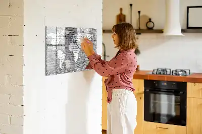 Magnetic glass dry erase board featuring a world map on a brick background