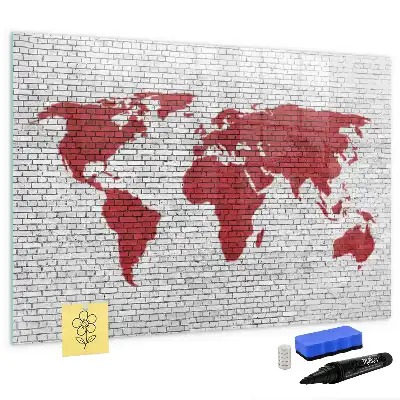 Magnetic marker board world map on a brick wall