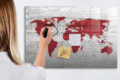 Magnetic marker board world map on a brick wall