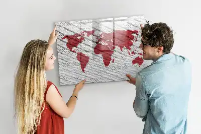 Magnetic marker board world map on a brick wall