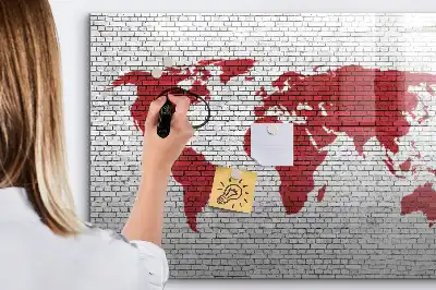 Magnetic marker board world map on a brick wall