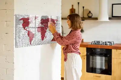 Magnetic marker board world map on a brick wall