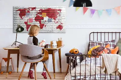 Magnetic marker board world map on a brick wall