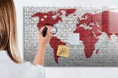 Magnetic marker board world map on a brick wall