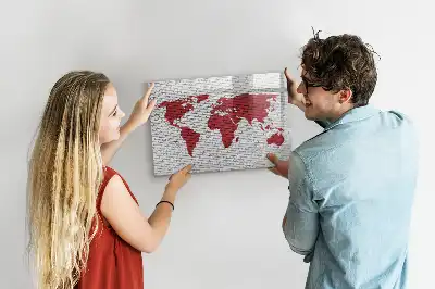 Magnetic marker board world map on a brick wall