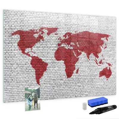 Magnetic marker board world map on a brick wall
