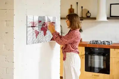 Magnetic marker board world map on a brick wall