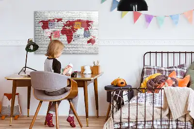 Magnetic marker board world map on a brick wall