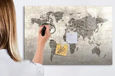 Magnetic marker board featuring a world map made from newspapers