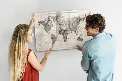 Magnetic marker board featuring a world map made from newspapers