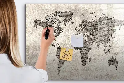 Magnetic marker board featuring a world map made from newspapers