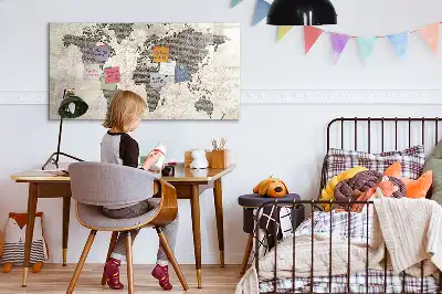 Magnetic marker board featuring a world map made from newspapers