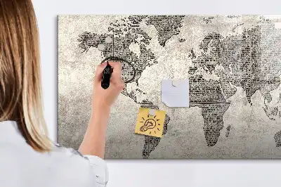 Magnetic marker board featuring a world map made from newspapers