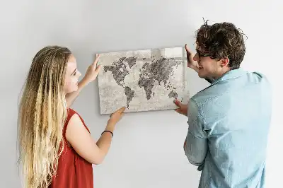 Magnetic marker board featuring a world map made from newspapers