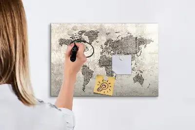 Magnetic marker board featuring a world map made from newspapers
