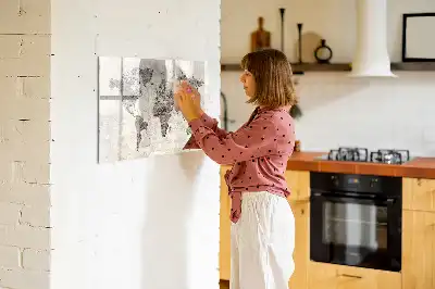 Magnetic marker board featuring a world map made from newspapers