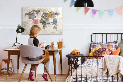 Magnetic marker board featuring a world map made from newspapers