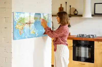 Magnetic glass dry erase board featuring a physical world map