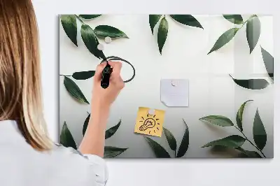 Magnetic glass dry erase board with a frame of leaves design