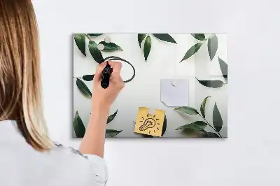 Magnetic glass dry erase board with a frame of leaves design