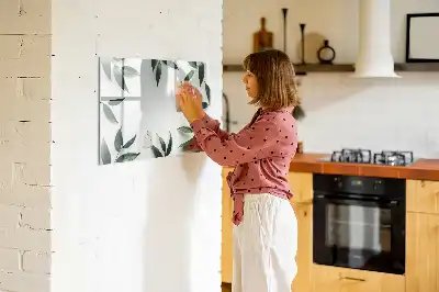 Magnetic glass dry erase board with a frame of leaves design