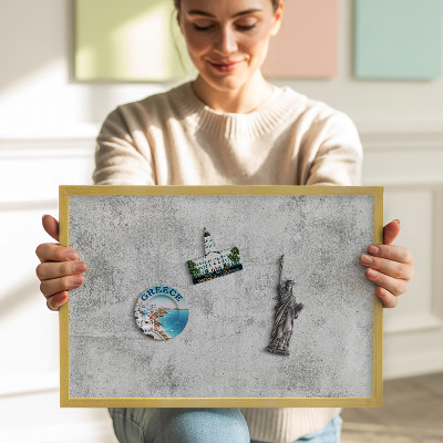 Magnetic board with a gold frame Worn concrete texture