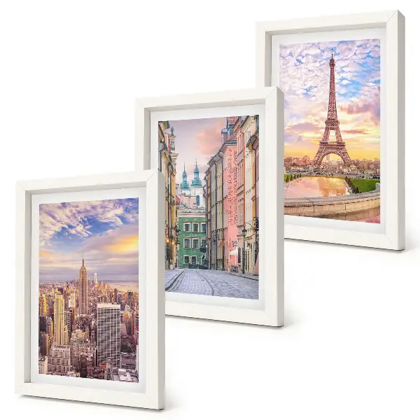 Photo frame wall featuring views of New York, Paris, and Warsaw at dusk