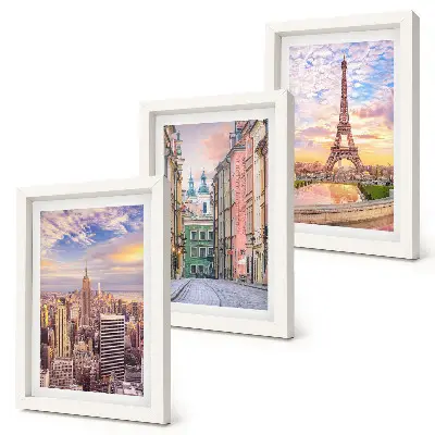 Photo frame wall featuring views of New York, Paris, and Warsaw at dusk