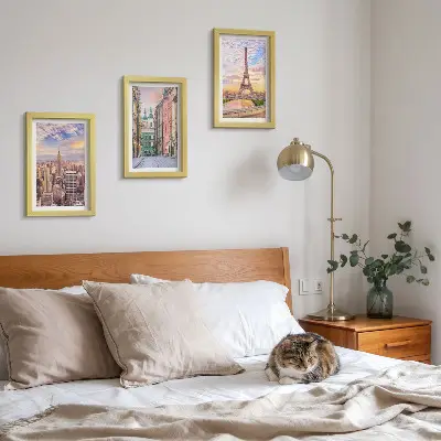 Photo frame wall featuring views of New York, Paris, and Warsaw at dusk