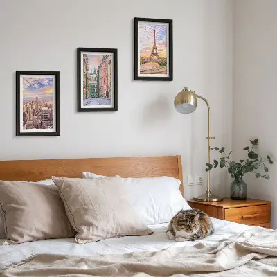 Photo frame wall featuring views of New York, Paris, and Warsaw at dusk