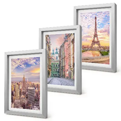 Photo frame wall featuring views of New York, Paris, and Warsaw at dusk