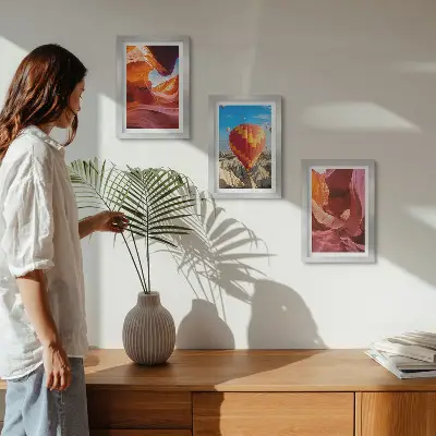 Framed triptych landscapes of desert gorges and a hot air balloon flight