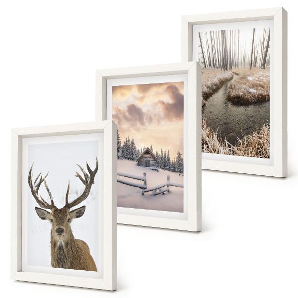 Photo frame wall Winter landscape with a deer hut and a stream