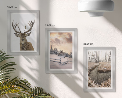 Photo frame wall Winter landscape with a deer hut and a stream
