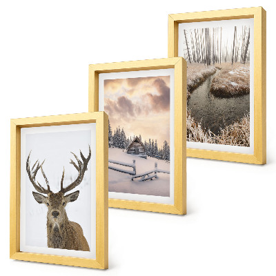 Photo frame wall Winter landscape with a deer hut and a stream