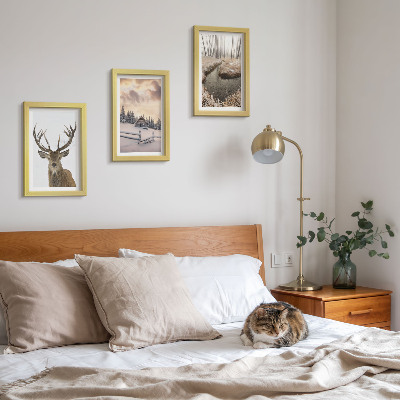 Photo frame wall Winter landscape with a deer hut and a stream