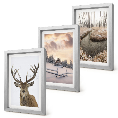 Photo frame wall Winter landscape with a deer hut and a stream
